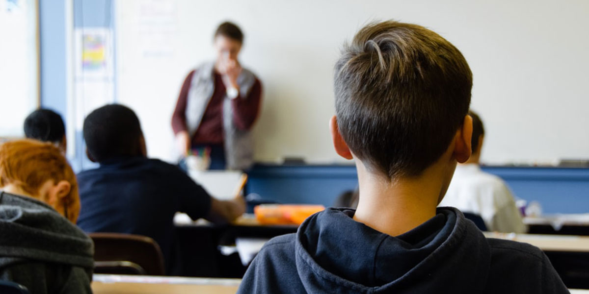 Student listening to teacher